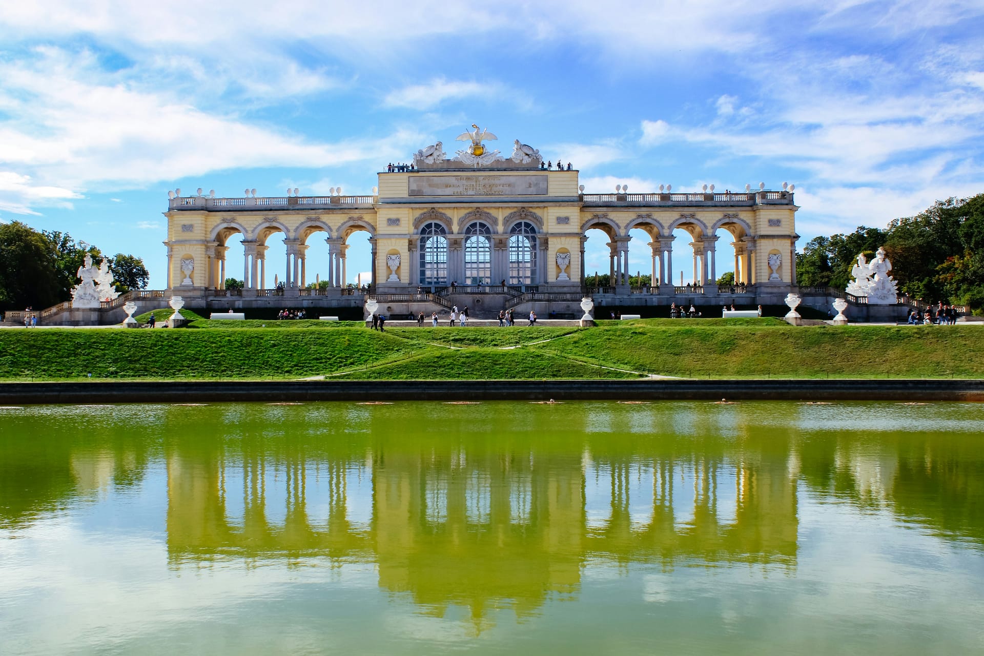 The Schönbrunn Palace and gardens in Vienna with the Gloriette monument visible on the hill behind