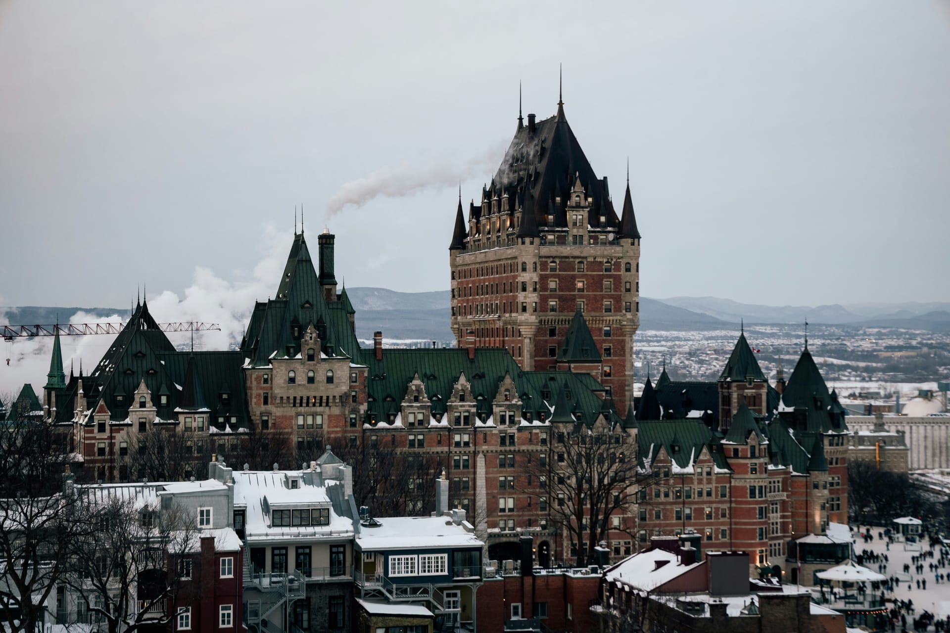 The Château Frontenac and old town of Quebec City in winter, photographed at golden hour with snow on the rooftops